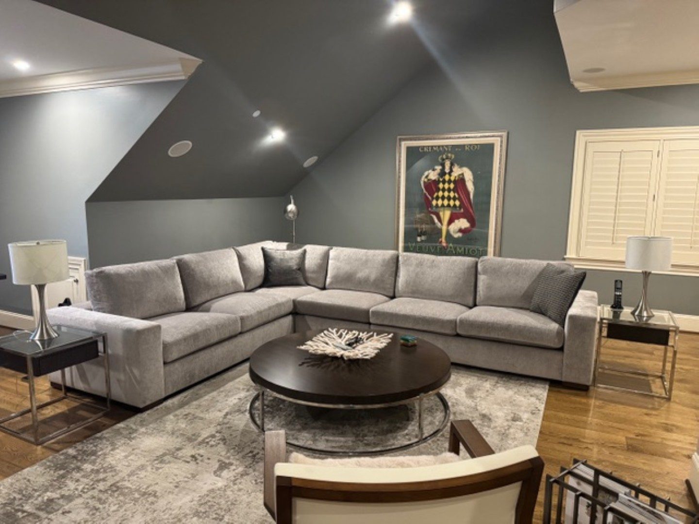 Light gray sectional under a vaulted ceiling